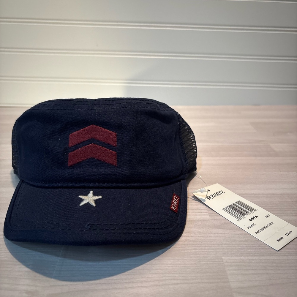 . Kurtz Fritz Trucker Cap. It is navy blue with a mesh back